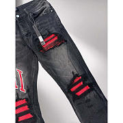 Amiri Staggered Logo Distressed Skinny Jean In Black Red - 2