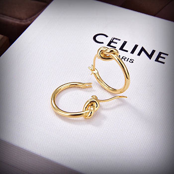 Celine's new gold knotted earrings